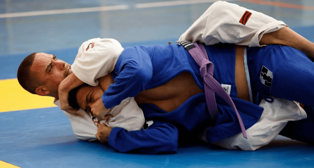 Rear naked choke locked in from back control during gi sparring